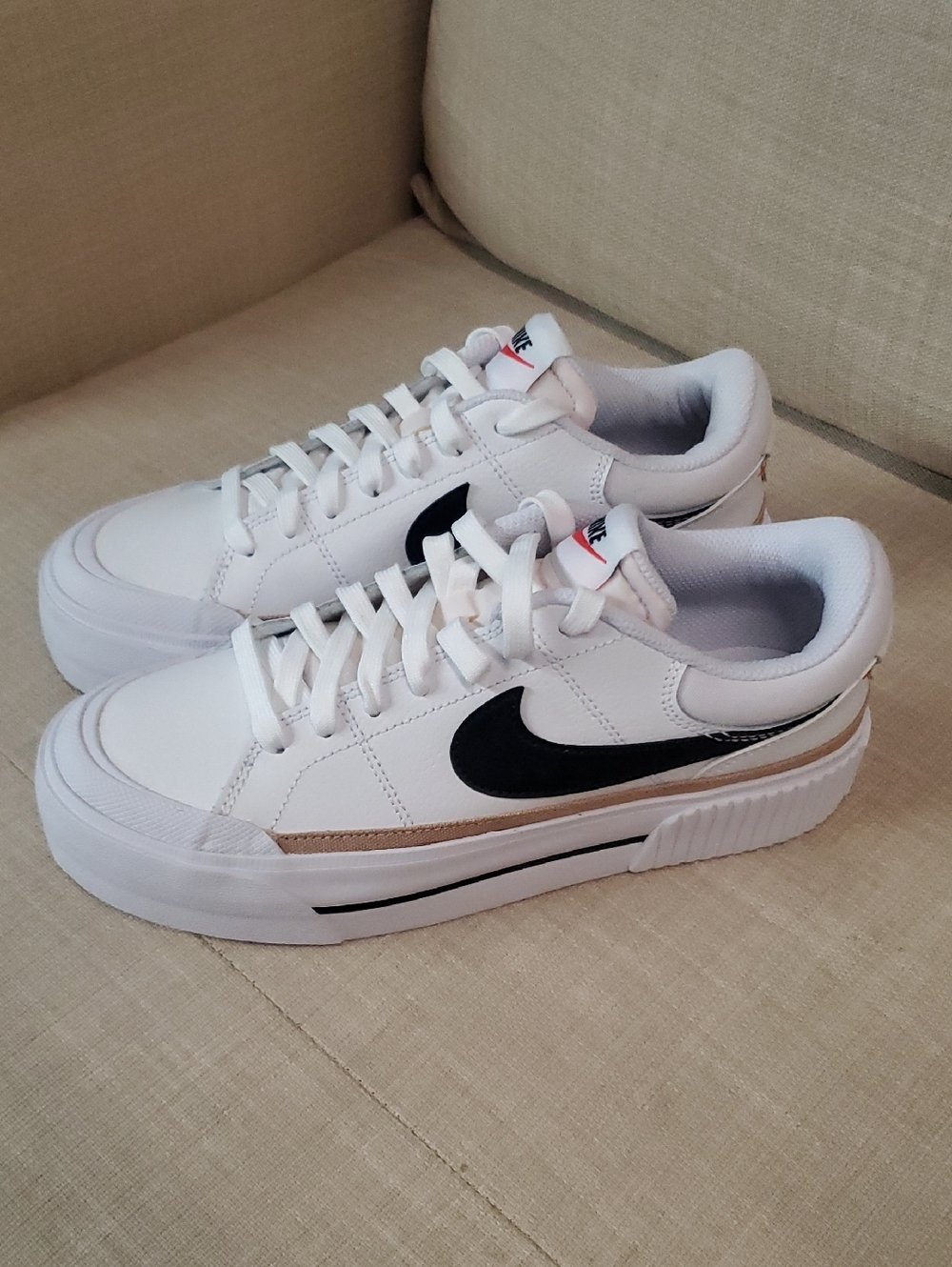 Nike Men's White Sneakers with Black Swoosh and Gold Trim Size 7.5